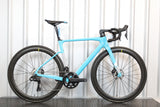 Light blue bicycle with black components on a white background